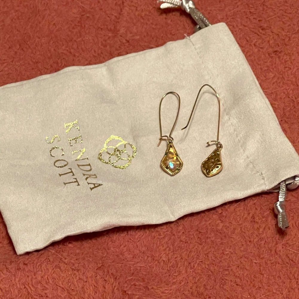 Kendra Scott drop earrings in filigree and peach.